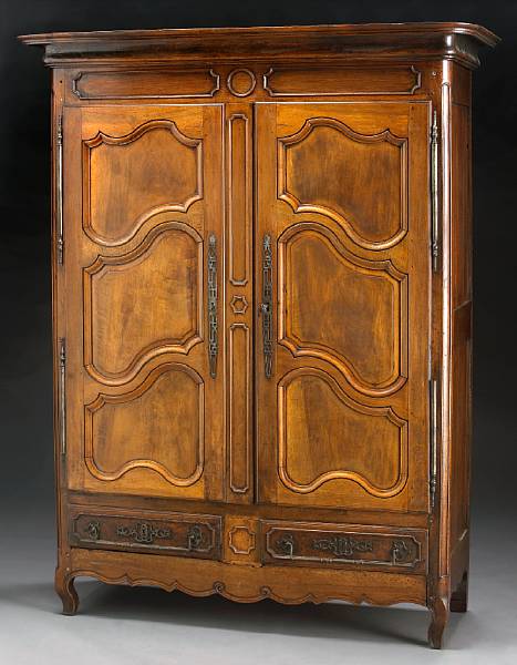 Appraisal: A French Provincial walnut armoire height ft in width ft