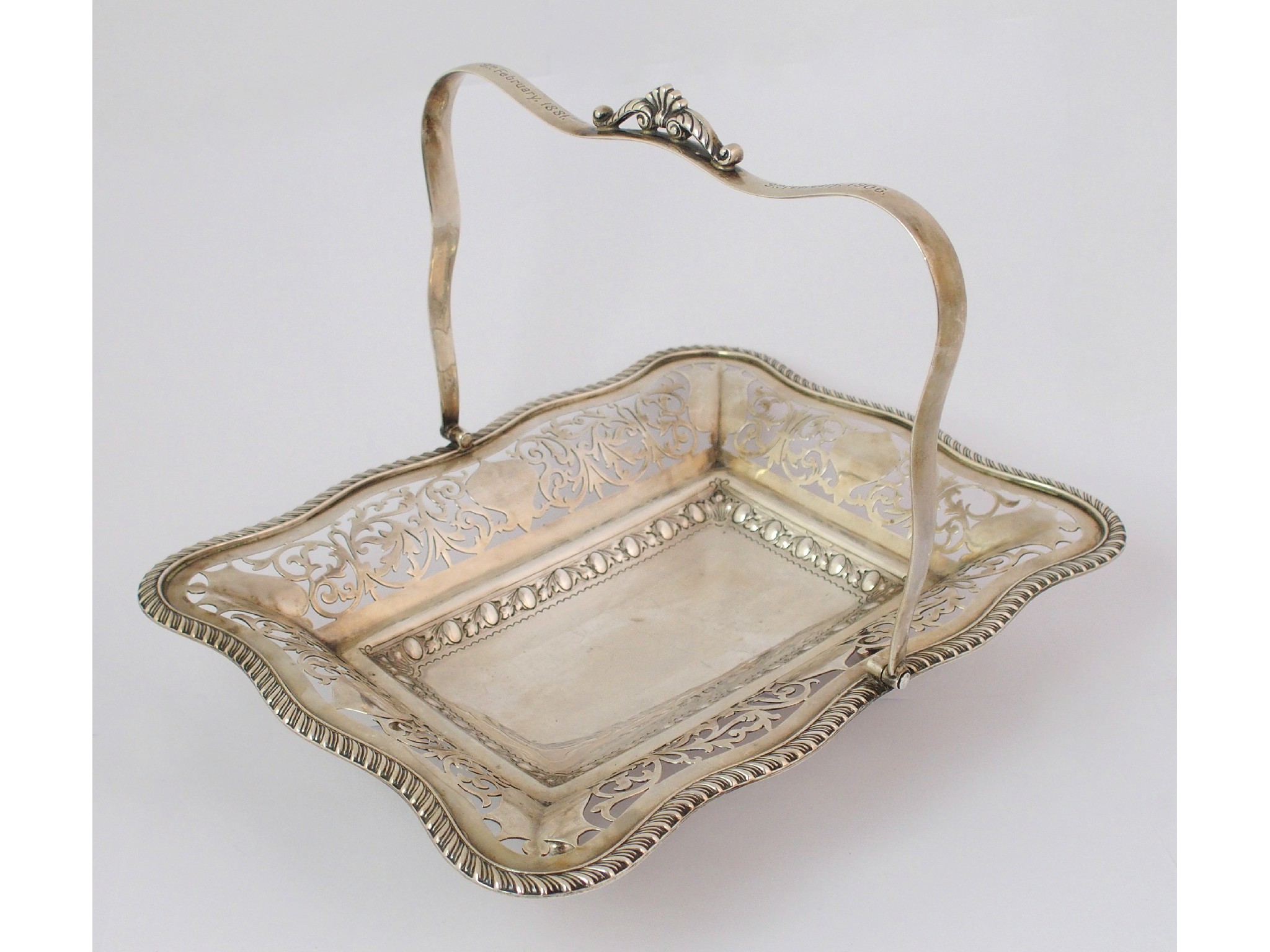 Appraisal: A swing handled silver cake basketunclear maker's marks Birmingham of