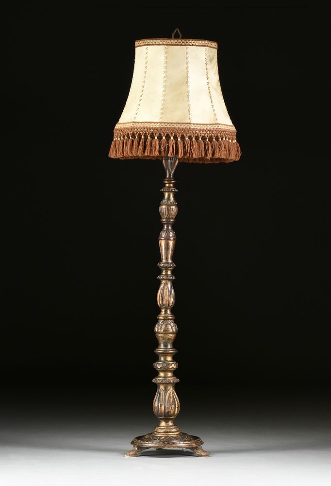 Appraisal: A BAROQUE STYLE SILVER AND BRONZE LEAFED WOOD FLOOR LAMP