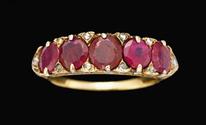 Appraisal: Yellow gold ruby and diamond ring Five oval cut rubies