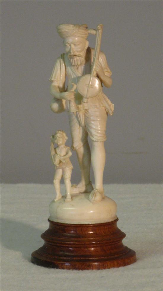 Appraisal: th century Indian ivory figure of a man and boy