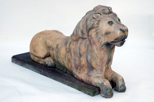 Appraisal: Cast iron garden lion Plinth base signed W W Jennings