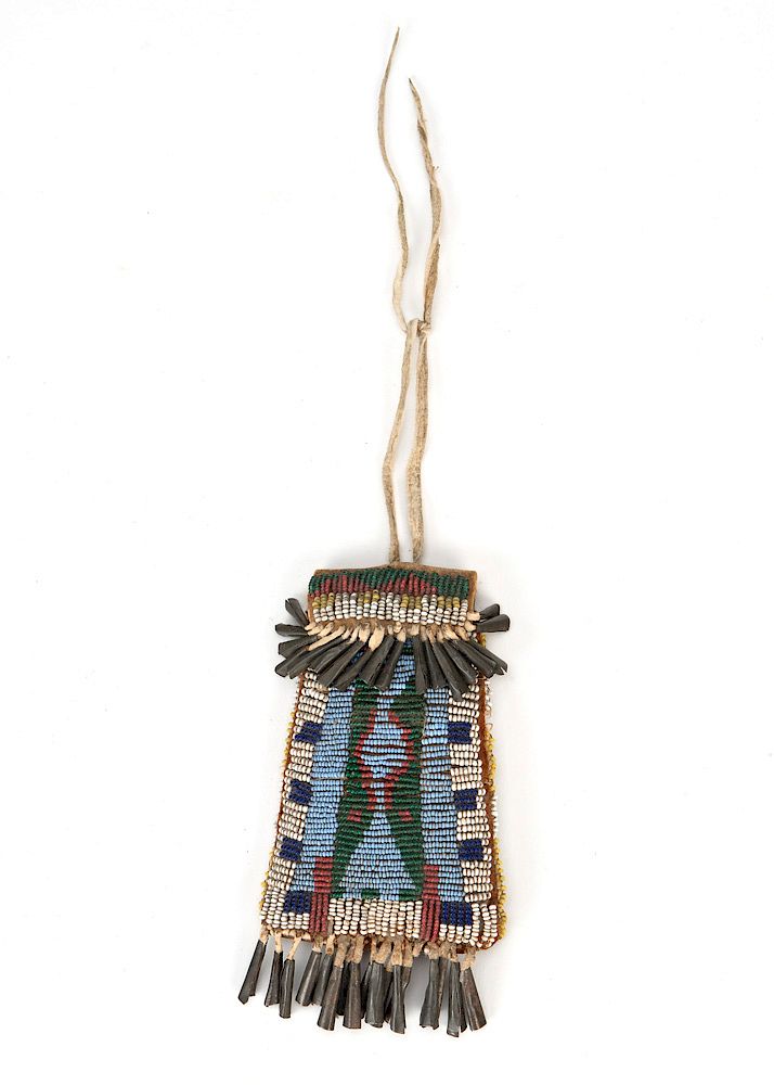 Appraisal: Arapaho Strike-A-Lite Arapaho Strike-A-Lite ca beaded hide with tin cones