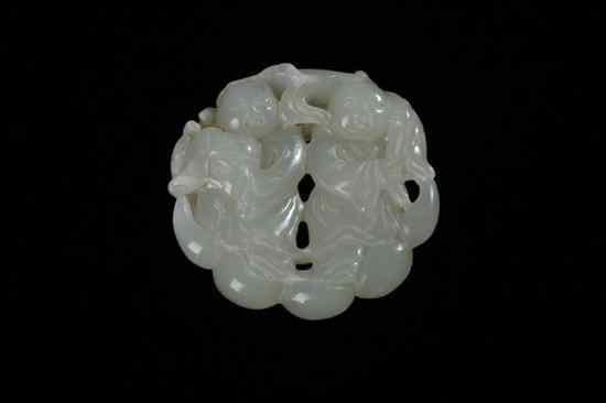 Appraisal: CHINESE LIGHT CELADON JADE CIRCULAR PENDANT Carved to depict two