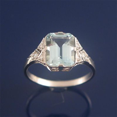 Appraisal: A diamond and aquamarine ring the emerald cut aquamarine is