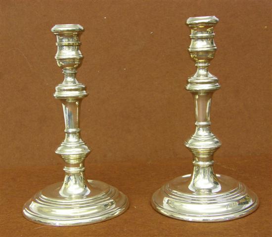 Appraisal: Pair of modern silver candlesticks in George II style multiple