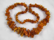 Appraisal: A graduated amber necklace approx cm long largest amber approx