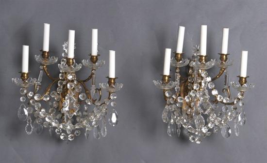 Appraisal: PAIR GILT-METAL FIVE-LIGHT SCONCES th century Shaped backplate issuing five