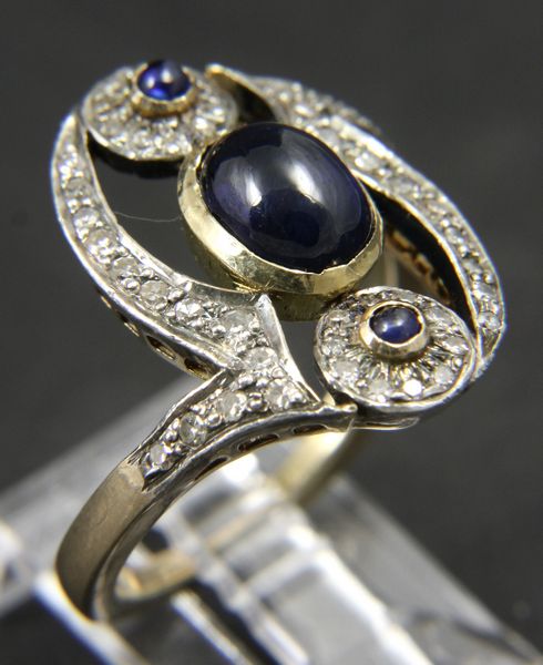 Appraisal: k yellow gold diamond and cabochon sapphire ring size ozt