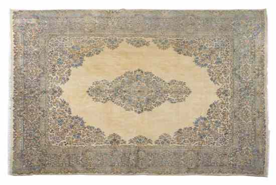 Appraisal: A Kirman Wool Carpet having a diamond form foliate center