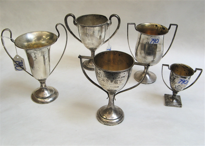 Appraisal: FIVE AMERICAN STERLING SILVER TROPHY CUPS double handled three having