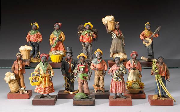 Appraisal: A group of thirteen painted wax and cloth African American