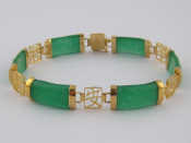 Appraisal: A Chinese yellow metal tests carat gold jade bracelet approx