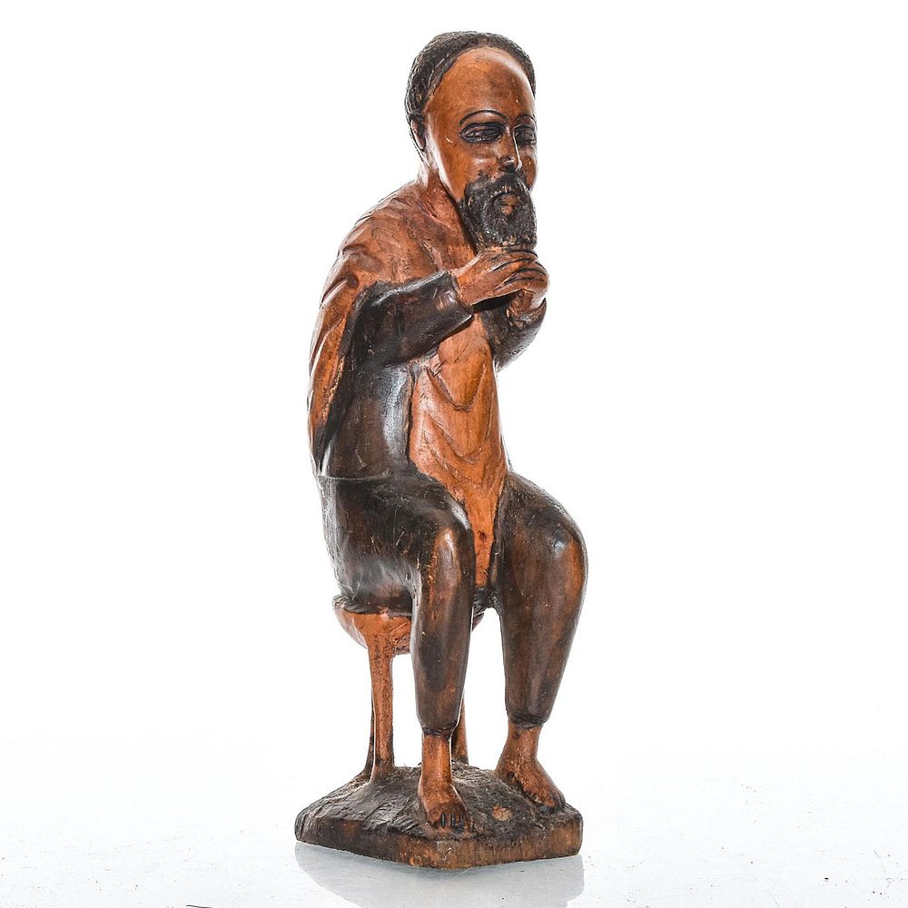 Appraisal: VINTAGE CARVED WOODEN TRIBAL FIGURE SEATED MAN Handcrafted wooden figure