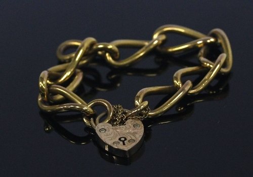 Appraisal: A ct gold bracelet with heart shaped padlock clasp approximately