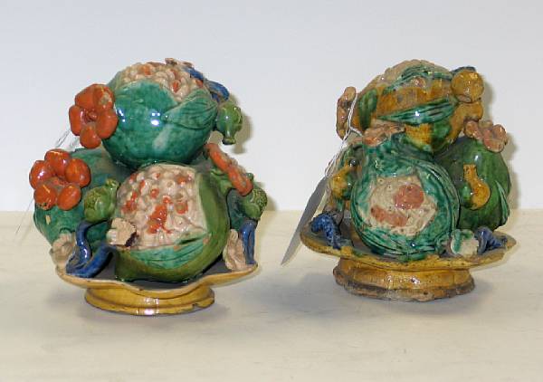 Appraisal: A pair of glazed pottery fruit offerings Each fashioned as