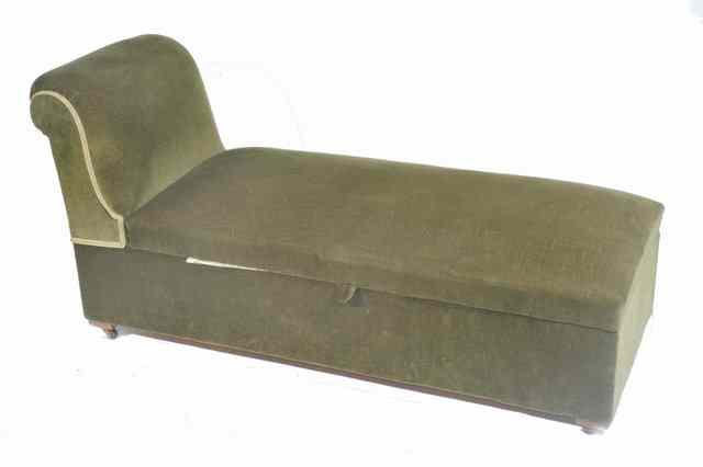 Appraisal: A VICTORIAN GREEN UPHOLSTERED OTTOMAN STOOL with scroll raised end