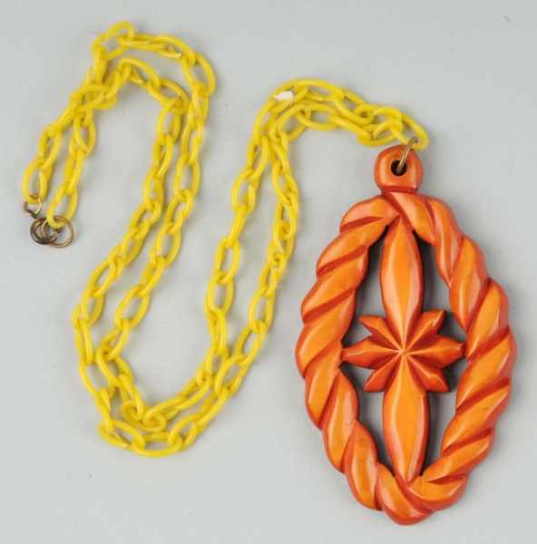 Appraisal: Bakelite Carved Dyed Pendant Condition Excellent