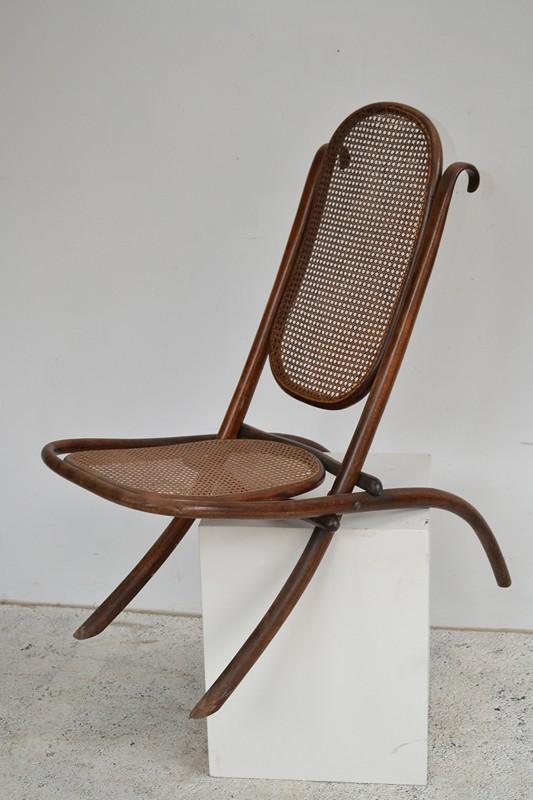 Appraisal: AN EARLY TH CENTURY BENT WOOD RATTAN FOLDING CHAIR AN