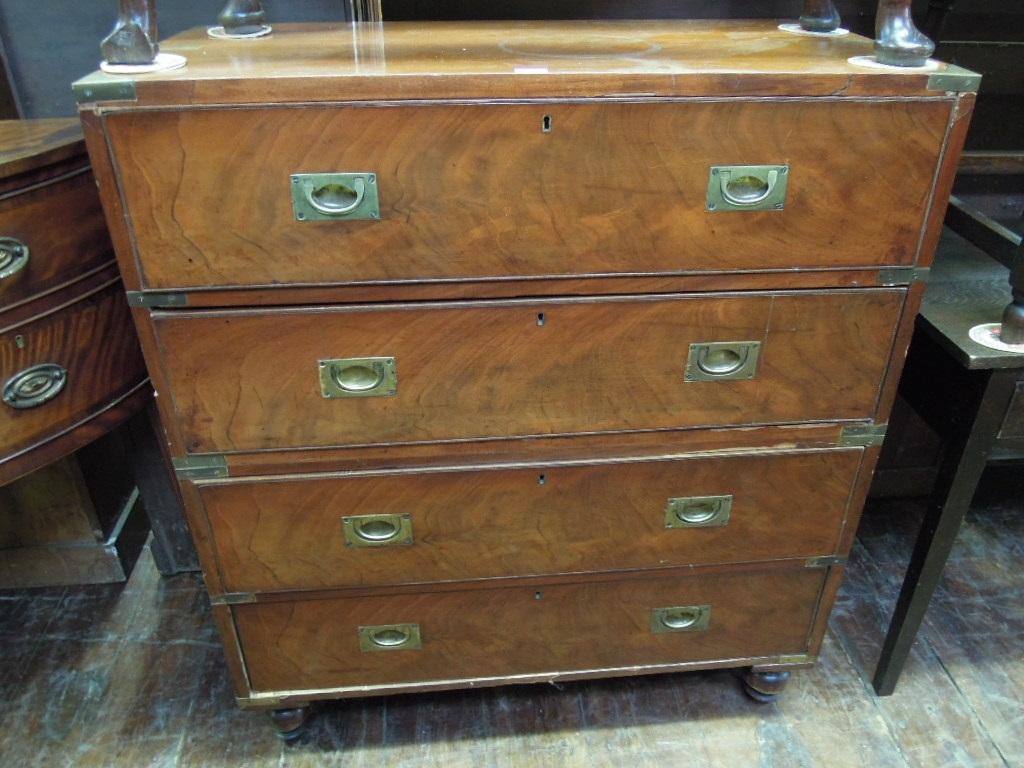 Appraisal: A th century mahogany campaign military chest fitted with four