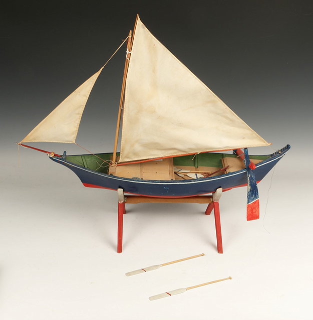 Appraisal: A SARAWAK WOODEN MODEL COASTAL SAILING BOAT as used by