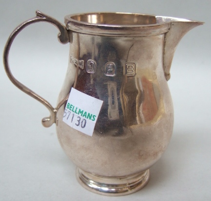 Appraisal: A silver Britannia standard cream jug of baluster form and