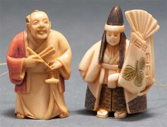 Appraisal: Two Japanese carved and tinted ivory netsukes standing samurai and