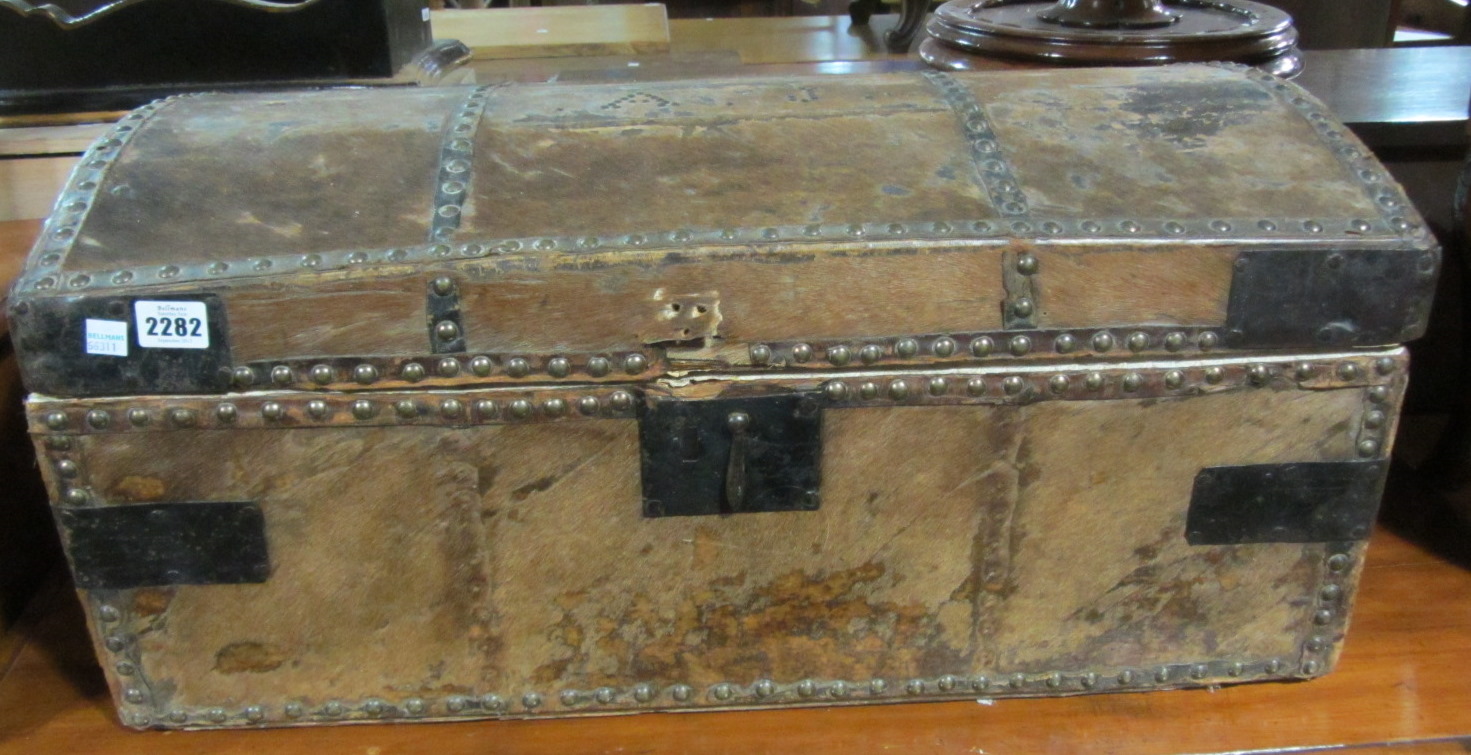 Appraisal: A domed top trunk covered with horse hyde