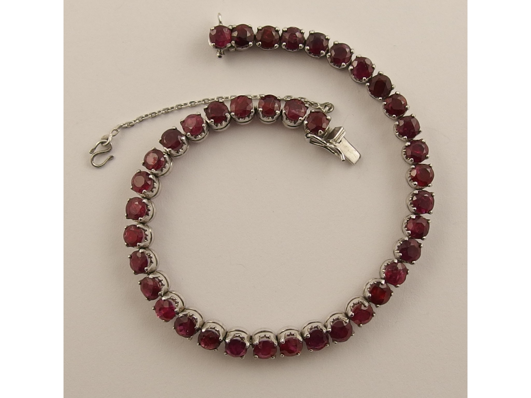 Appraisal: A ruby line braceletthe thirty nine facet cut rubies are