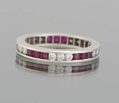 Appraisal: A Ladies' Platinum Diamond and Ruby Eternity Ring Platinum eternity