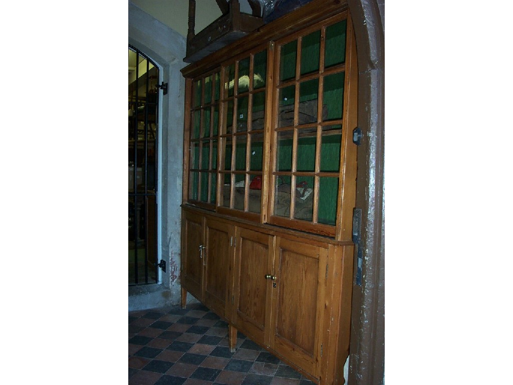 Appraisal: A large stripped pine -tier kitchen cabinet the upper section