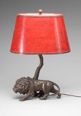 Appraisal: Metal lion lamp spelterware lion with tree supporting shade -