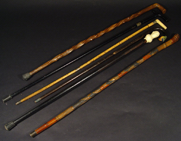 Appraisal: Six walking canes one ebonised with a composite military bust