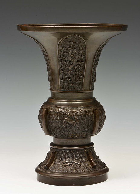 Appraisal: A CHINESE BRONZE ARCHAIC STYLE VASE with panels of raised