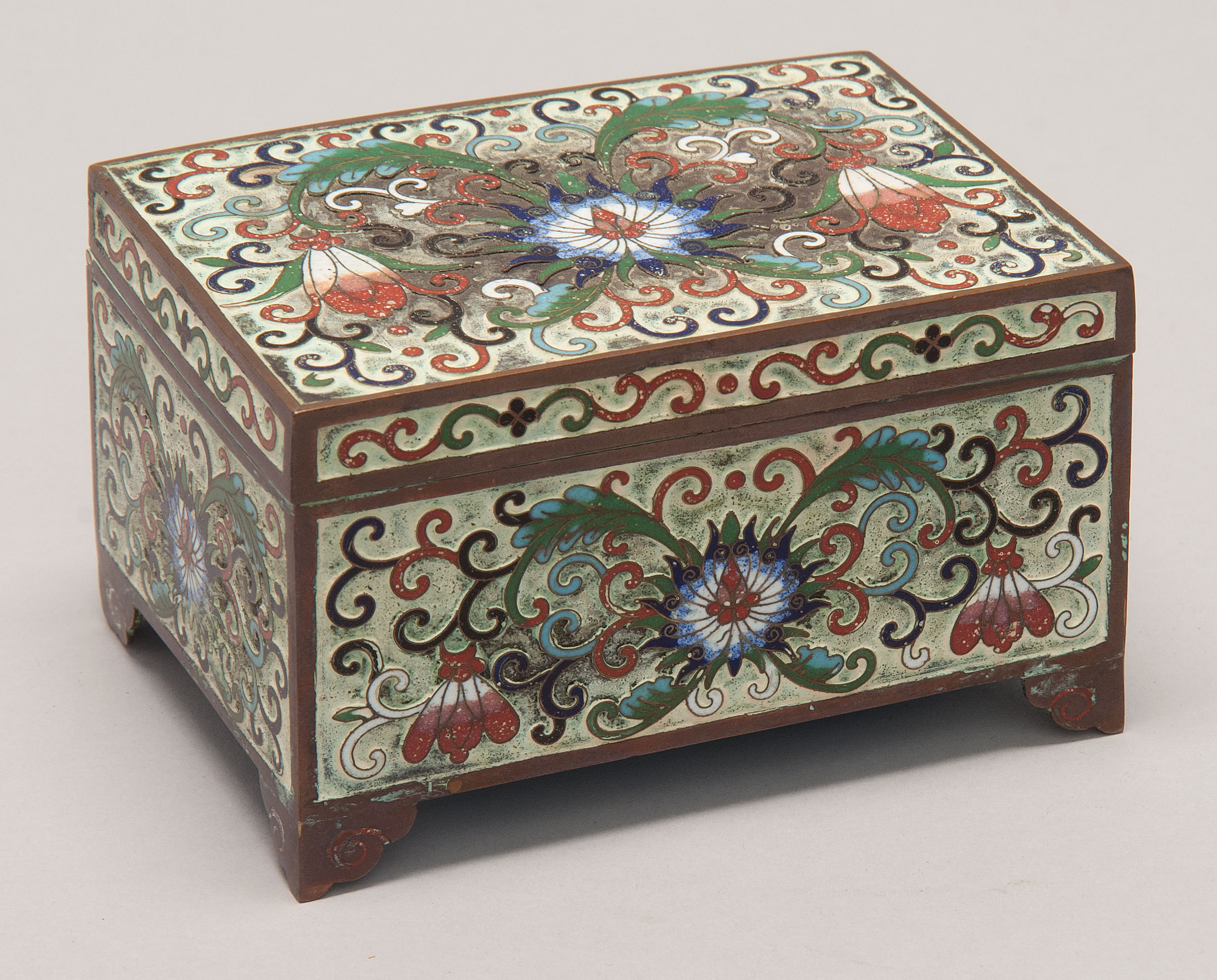 Appraisal: SCULPTED CLOISONN ENAMEL BOX th CenturyIn rectangular form with passionflower