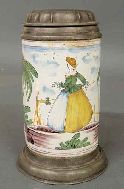 Appraisal: Early faience earthenware stein with painted woman and tree decoration