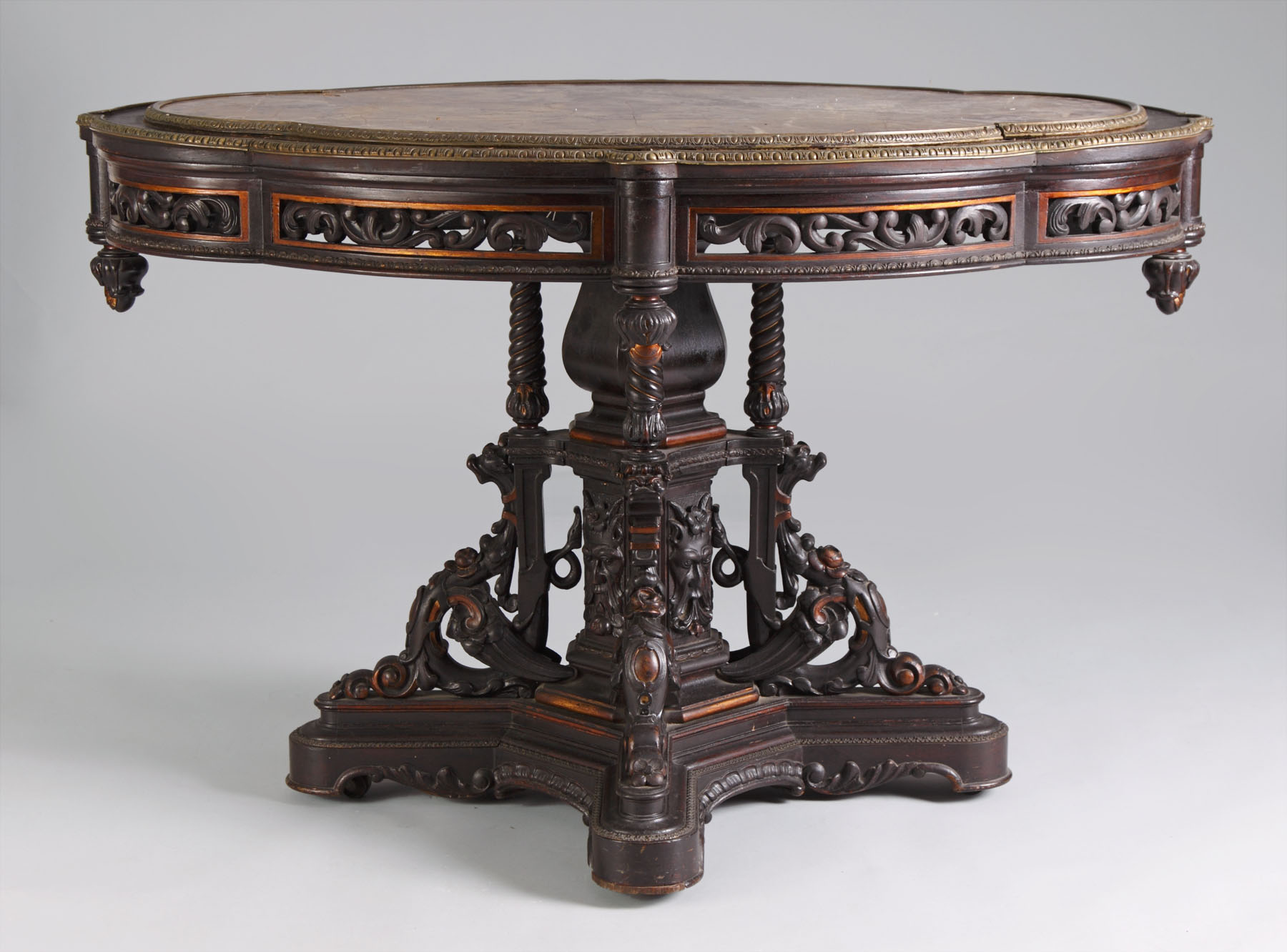 Appraisal: Pierce Carved Rosewood Fossilized Marble Top Table Brass mounts gilded