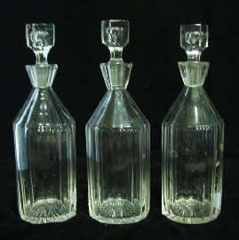 Appraisal: Three crystal decanters and stoppers with star cut basses cm