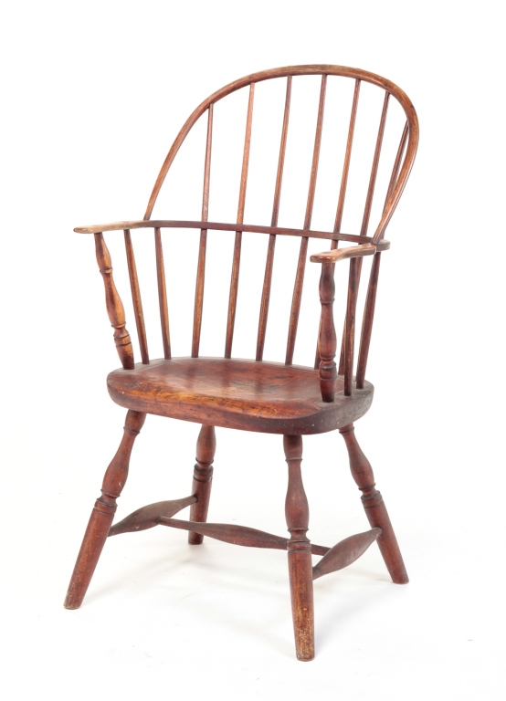 Appraisal: AMERICAN SACKBACK WINDSOR ARMCHAIR Late th-early th century mixed woods