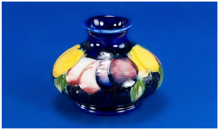 Appraisal: Moorcroft Small Squat Vase Polychrome Plum Pattern on Deep Blue