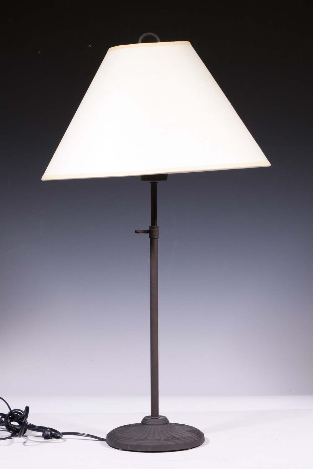 Appraisal: TABLE LAMP WITH PAPER SHADE Metal table lamp with paper