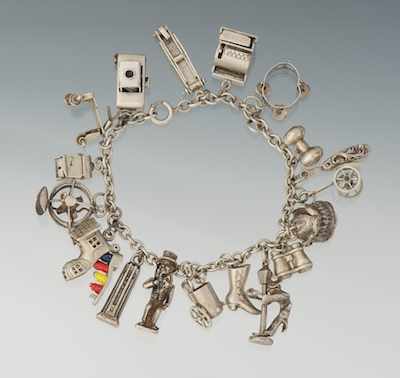 Appraisal: A Sterling Silver Bracelet with Amusing Charms Sterling silver oval