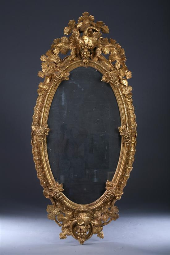 Appraisal: GILT-GESSO OVER WOOD OVAL WALL MIRROR early th century Open-work