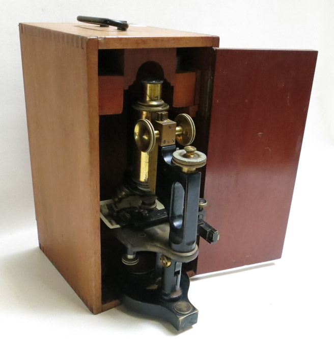 Appraisal: BAUSCH LOMB MICROSCOPE with triple head optics and wood storage