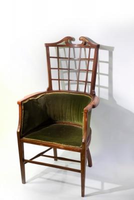 Appraisal: An Aesthetic movement armchair with trellis type back