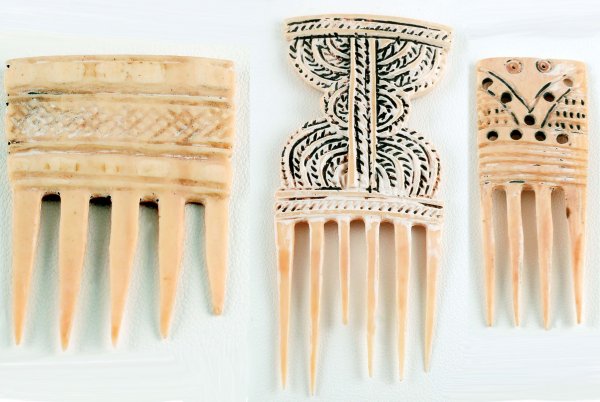 Appraisal: Three West African ivory hair combs One - with carved