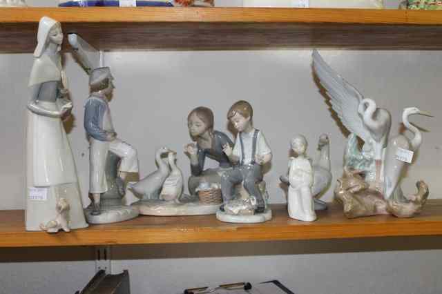 Appraisal: A COLLECTION OF THREE LLADRO FIGURES 'Boy with Sailing Ship'