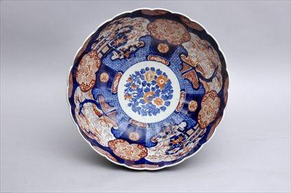 Appraisal: JAPANESE IMARI PORCELAIN FOOTED BOWL The hemispherical reeded bowl with