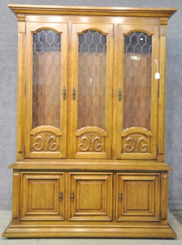 Appraisal: Meditteranean Style China CabinetHaving three grilled glazed doors above three