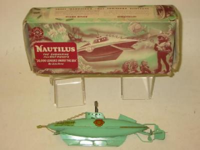 Appraisal: A Sutcliffe Nautilus submarine green clockwork powered long box AF